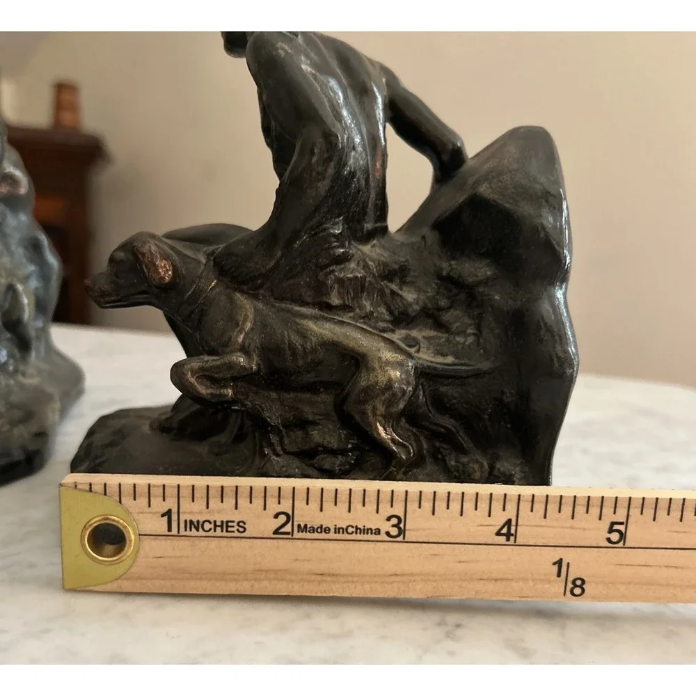 Antique Meal metal cast Indian bookends. Good condition.